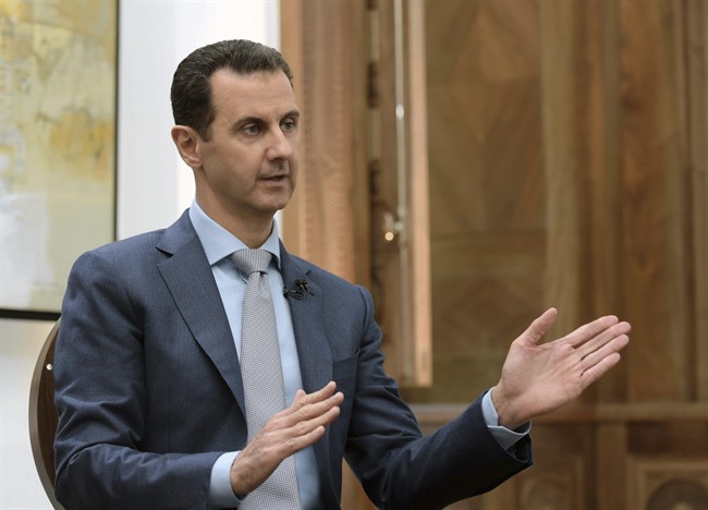 In this photo released by the Syrian official news agency SANA, Syrian President Bashar Assad speaks during an interview with Yahoo News in Damascus, Syria, Friday, Feb. 10, 2017. Assad said, there are "definitely" terrorists among the millions of Syrians seeking refuge in the West. He said it doesn't have to be a "significant" number of terrorists because no need for a significant "number to commit atrocities." (SANA via AP).