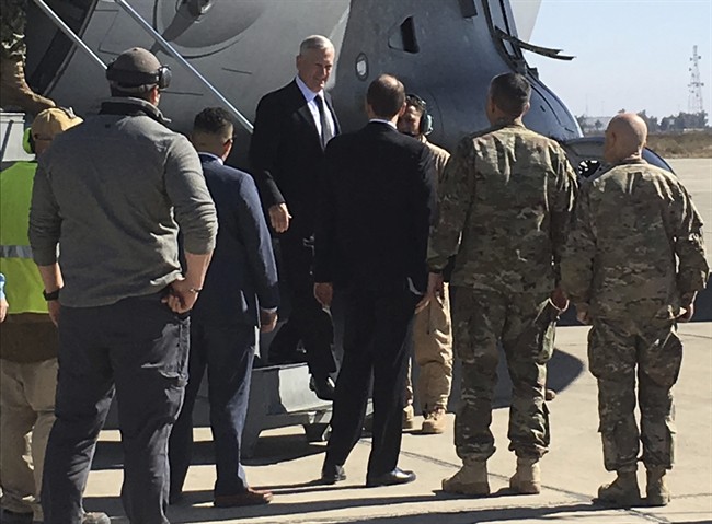 U.S. Secretary of Defense Jim Mattis, center, arrives at Baghdad International Airport, Iraq, on an unannounced trip Feb. 20, 2017.