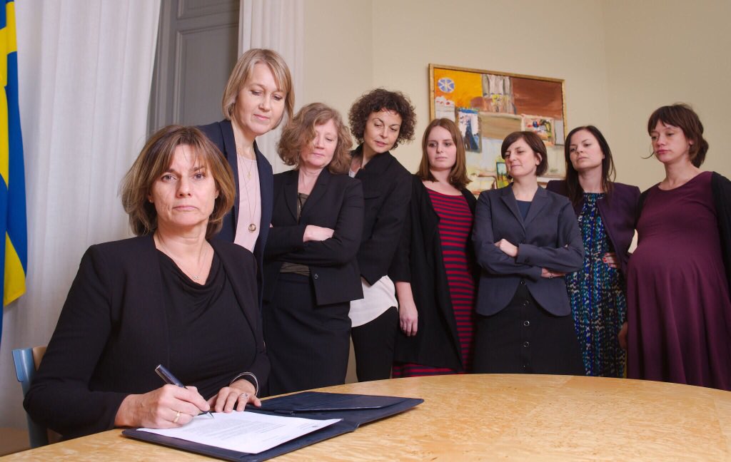 Swedish Deputy Prime Minister Isabella Lövin signs a climate change law.