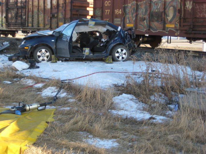 RCMP investigate after a woman was rushed to hospital when a train collided with the car she was driving in Coaldale, Alta. on Feb. 2, 2017.