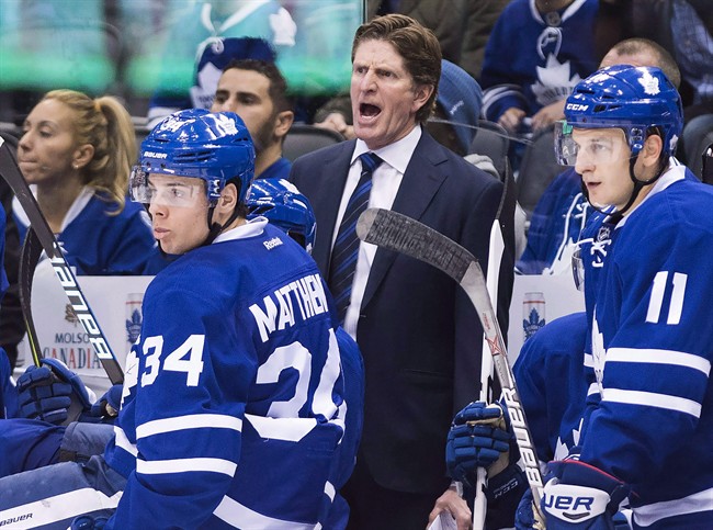 Toronto Maple Leafs head coach Mike Babcock, centre, watched his team drop a 2-0 decision to Tampa Bay Tuesday night.