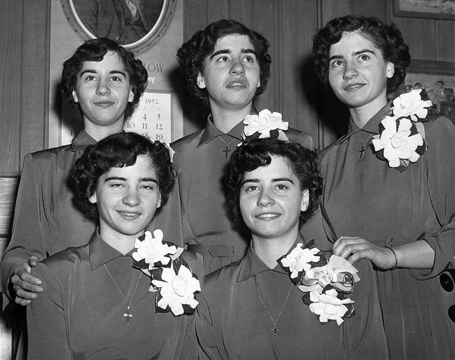 The Dionne quintuplets are shown in a 1952 photo. Front row (left to right) Cecile and Yvonne, and back row (left to right) Marie, Emilie and Annette. 