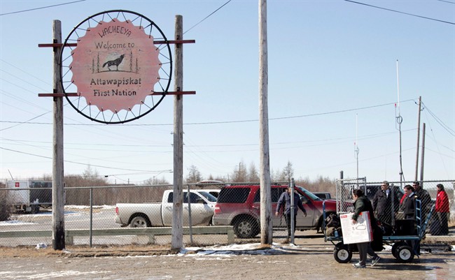 A new school in a remote northern Ontario indigenous community has been closed for more than a month after a malfunctioning sprinkler system flooded the building. A sign welcomes visitors at the Attawapiskat airport in the remote northern Ontario community, in an April 18, 2016, file photo. 