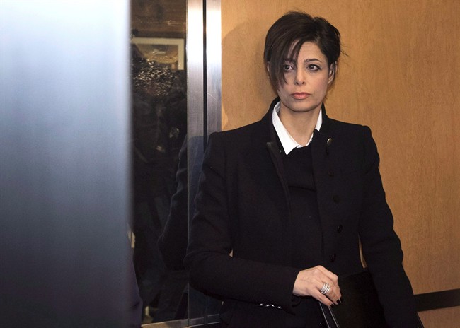 Marie Henein, criminal defence lawyer for CBC Radio host Jian Ghomeshi, stands in an elevator while arriving at court in Toronto on Thursday, February 26, 2015. A speech by Marie Henein, Jian Ghomeshi's lawyer, will go ahead at three Canadian universities despite opposition from some students in Nova Scotia. 