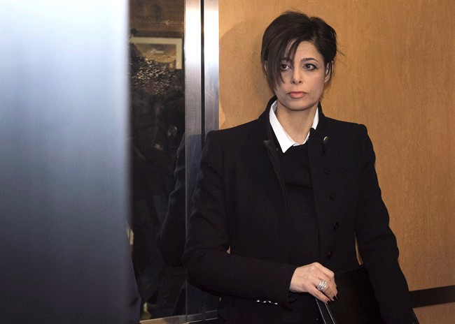 Marie Henein, criminal defence lawyer for CBC Radio host Jian Ghomeshi, stands in an elevator while arriving at court in Toronto on Thursday, February 26, 2015. A speech by Marie Henein, Jian Ghomeshi's lawyer, will go ahead at three Canadian universities despite opposition from some students in Nova Scotia. 
