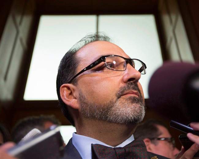Ontario Energy Minister, Glenn Thibeault arrives to speak with the media in Toronto on Monday Sept. 12, 2016.