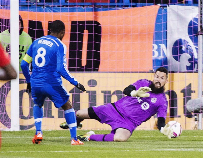 Montreal Impact midfielder Patrice Bernier (8) scores the first goal against Toronto FC goalkeeper Chris Konopka (1) during first half Major League Soccer sudden death playoff game in Montreal on October 29, 2015. Former Toronto FC goalkeeper Chris Konopka has joined FC Edmonton of the North American Soccer League. 
