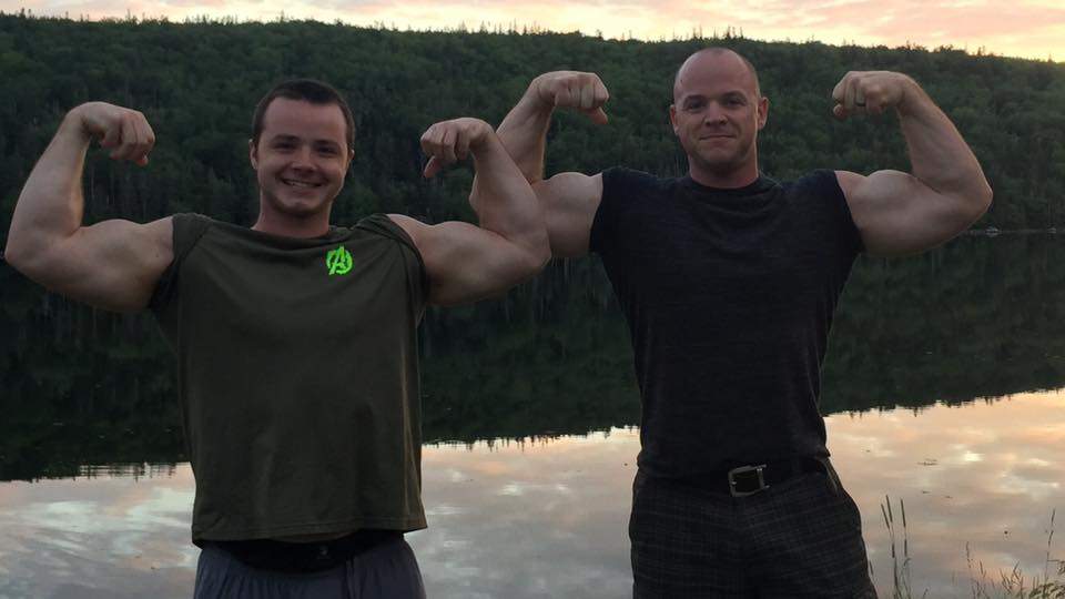 Daniel Broussard (right) flexes with his nephew, Ian Macneil.