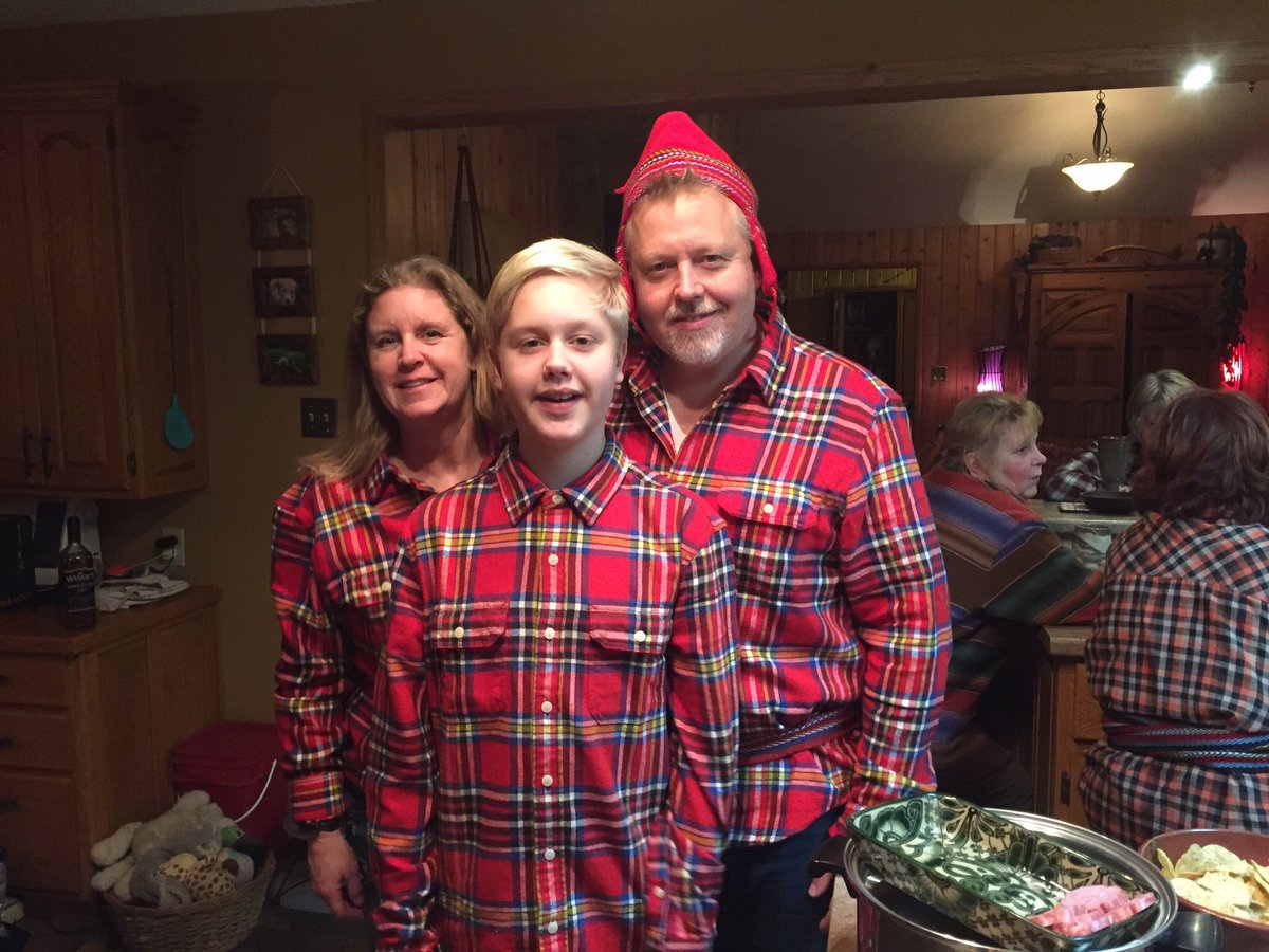 Winner of the Wear Your Plaid contest, Darren Skog, stands with his wife, Angela and son Avery. 