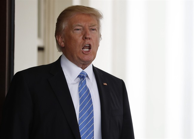 President Donald Trump calls out to the media after escorting Israeli Prime Minister Benjamin Netanyahu to his car to depart the White House in Washington, Wednesday, Feb. 15, 2017. (AP Photo/Carolyn Kaster).