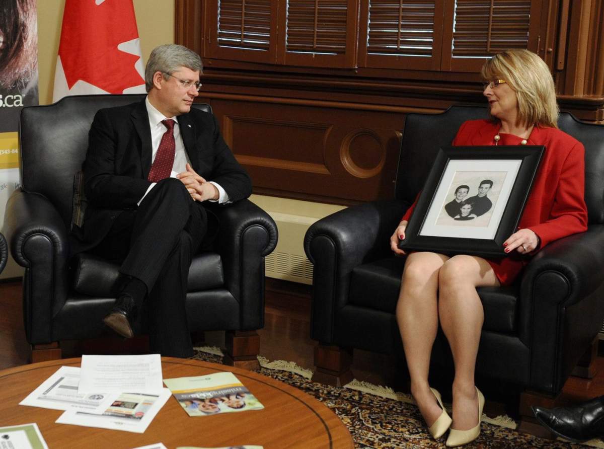 Prime Minister Stephen Harper meets with Diana Boland (mother of the O`Brian boys, Adam ‘ Trevor, and Mitchell) in his office in the Langevin Block in Ottawa on Tuesday, May 24, 2011., to raise awareness of the National Day for Missing Children on May 25th and the launching of a website missingchildren.ca.
