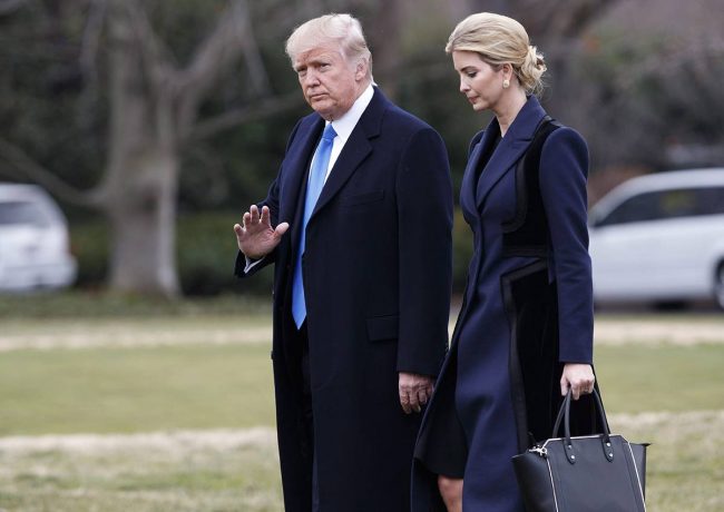 President Donald Trump, accompanied by his daughter Ivanka, waves as they walk to board Marine One on the South Lawn of the White House in Washington, Feb. 1, 2017.