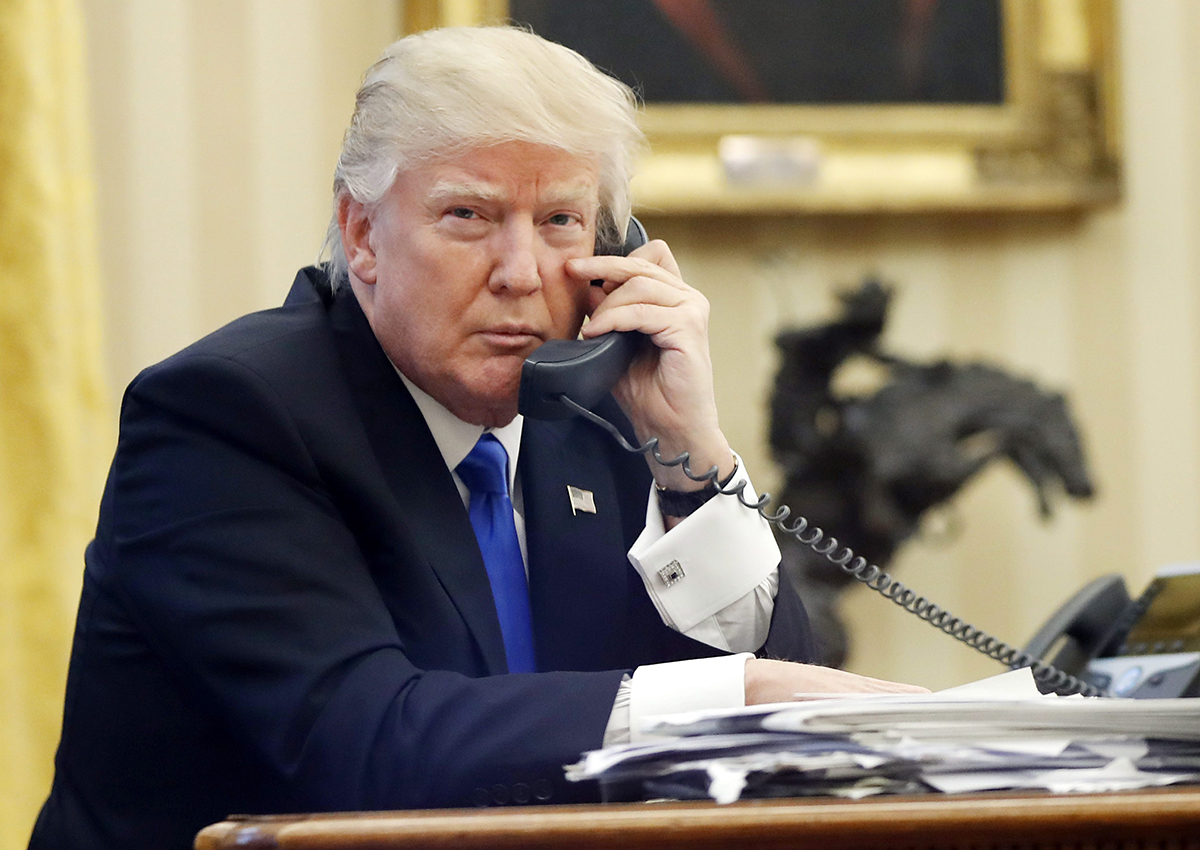 In this Jan. 28, 2017, file photo, U.S. President Donald Trump speaks on the phone.