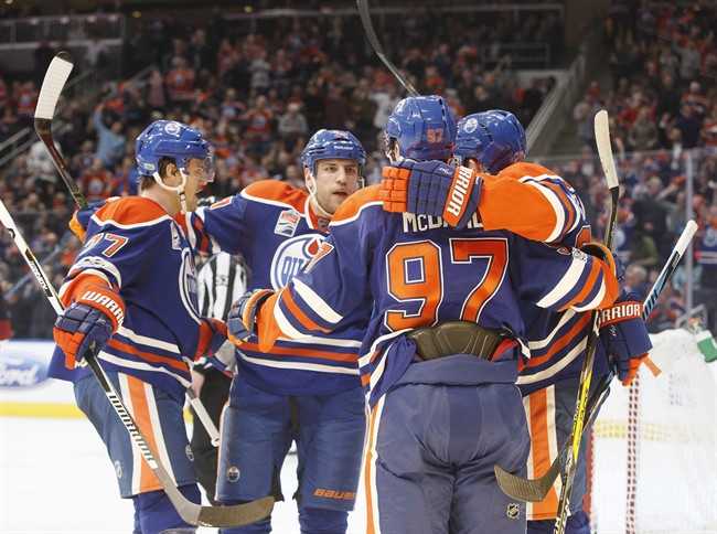Edmonton Oilers defenceman Oscar Klefbom (77), left wing Milan Lucic (27), centre Connor McDavid (97) and centre Leon Draisaitl (29) celebrate a goal against the Arizona Coyotes during second period NHL action in Edmonton, Alta., on Tuesday February 14, 2017. 