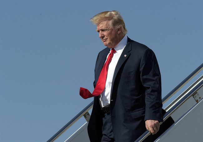 President Donald Trump walks down the steps of Air Force One as he arrives a Palm Beach International Airport in West Palm Beach, Fla., Friday, Feb. 17, 2017. 