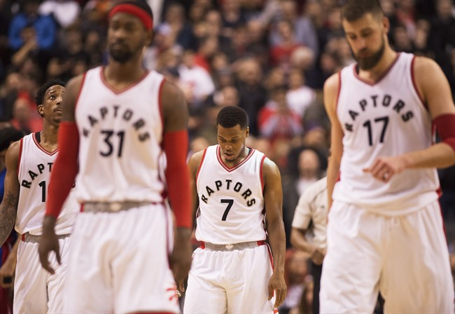 Toronto Raptors guard Kyle Lowry (7) and teammates walk off the court after losing to the Detroit Pistons in NBA basketball action in Toronto on Sunday, Feb.12, 2017.