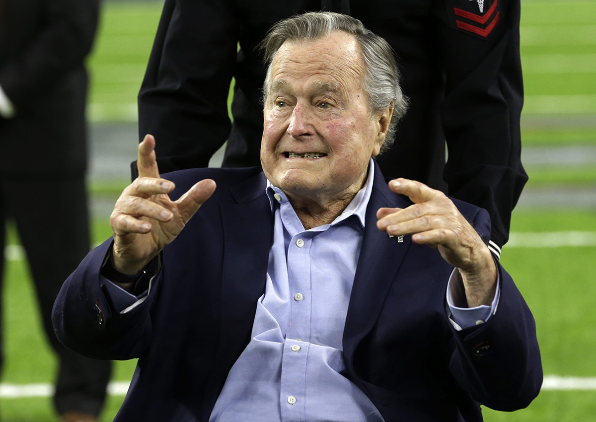 Former President George H.W. Bush arrives on the field for a coin toss before the NFL Super Bowl 51 football game between the Atlanta Falcons and the New England Patriots Sunday, Feb. 5, 2017, in Houston.