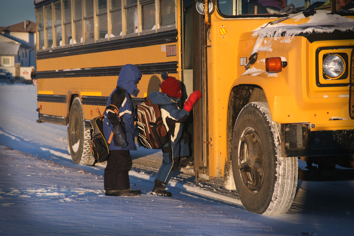 A file photo of children getting on a school bus in Quebec.