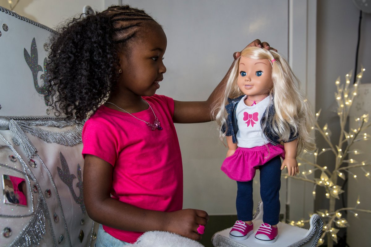 Jayla, aged 4, plays with a 'My Friend Cayla' doll in the Hamleys toy shop on June 26, 2014 in London, England.  