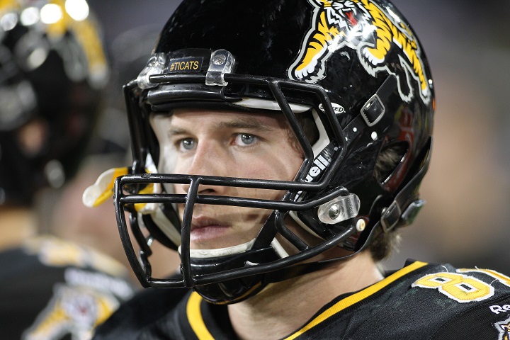 Matt Coates watches the play during a CFL game between the Hamilton Tiger-Cats and Edmonton Eskimos in Hamilton, ON on Sept. 20, 2014.