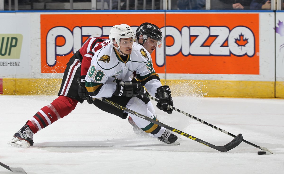 Victor Mete #98 of the London Knights tries to control the puck against the Guelph Storm.(Photo by Claus Andersen/Getty Images).