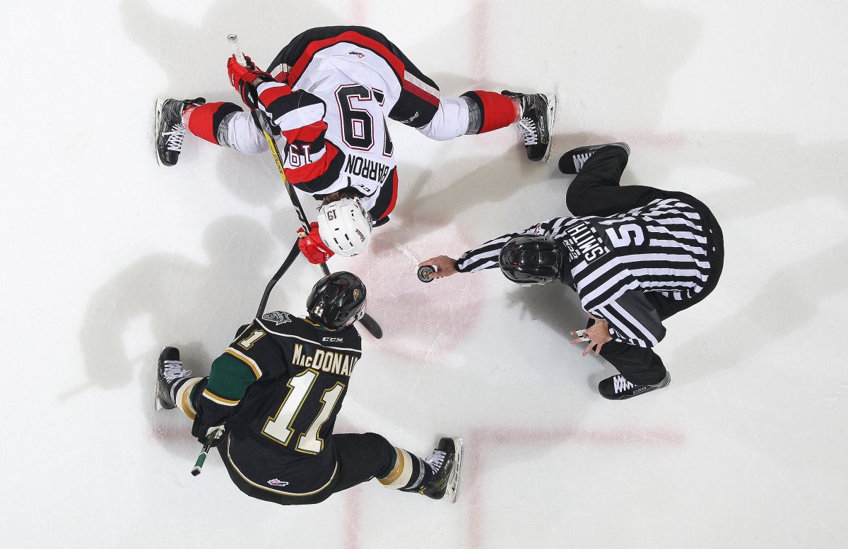 Owen MacDonald #11 of the London Knights takes a faceoff against Travis Barron #19 of the Ottawa 67's (Photo by Claus Andersen/Getty Images).