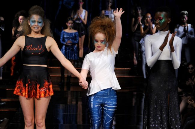 Madeline Stuart walks the runway with models during 21 Reasons Why By Madeline Stuart at New York Fashion Week Art at the Angel Orensanz Center in New York City, Feb. 12, 2017.