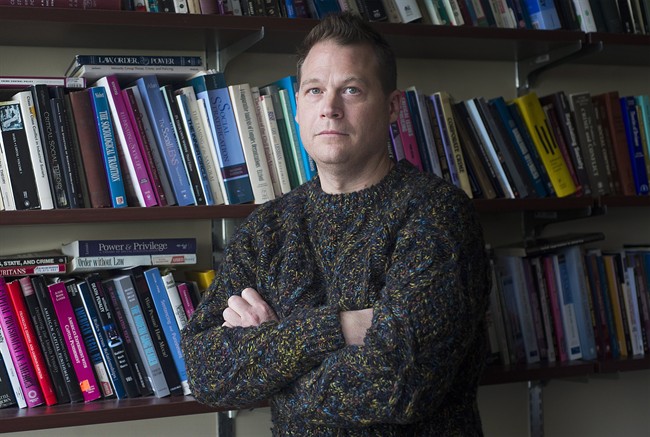 Jason Carmichael, an associate professor in the department of sociology at McGill University poses in his office in Montreal, Thursday, February 23, 2017. During the summers of 2015 and 2016 McGill University professor Jason Carmichael tried to study what factors influenced sentencing outcomes for people convicted of drunk driving, but he ran into a problem. 