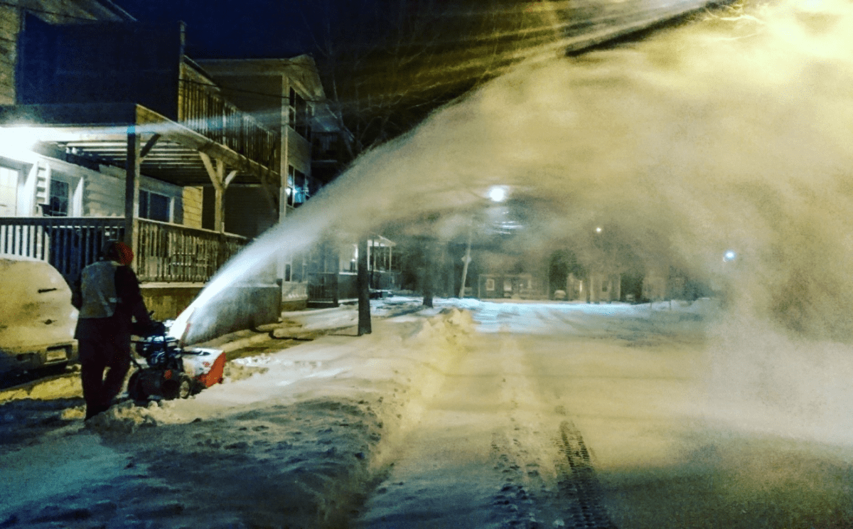 A person clears snow from a driveway in Halifax on Feb. 10, 2017 after a storm dropped nearly 20 centimetres of snow overnight.