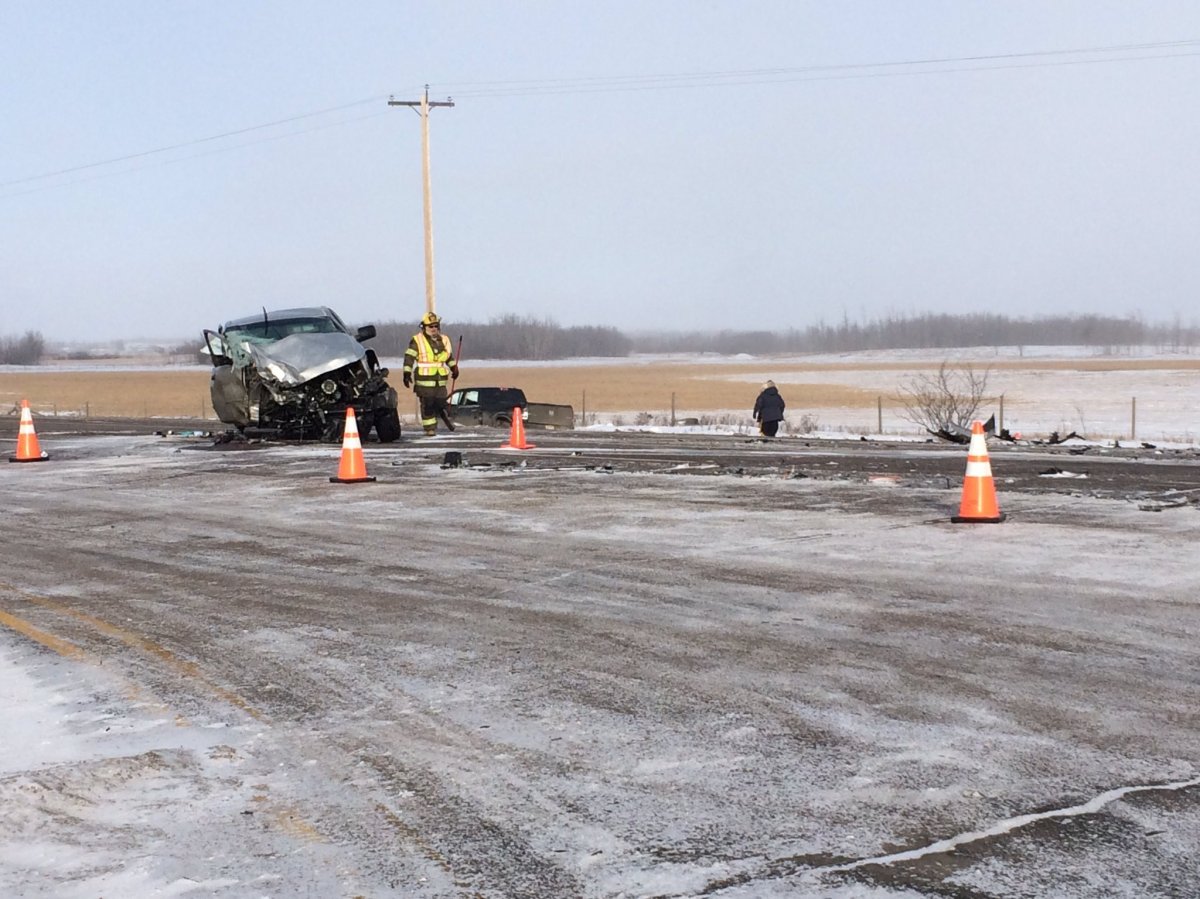 RCMP officers at the scene of a fatal collision east of Edmonton.
