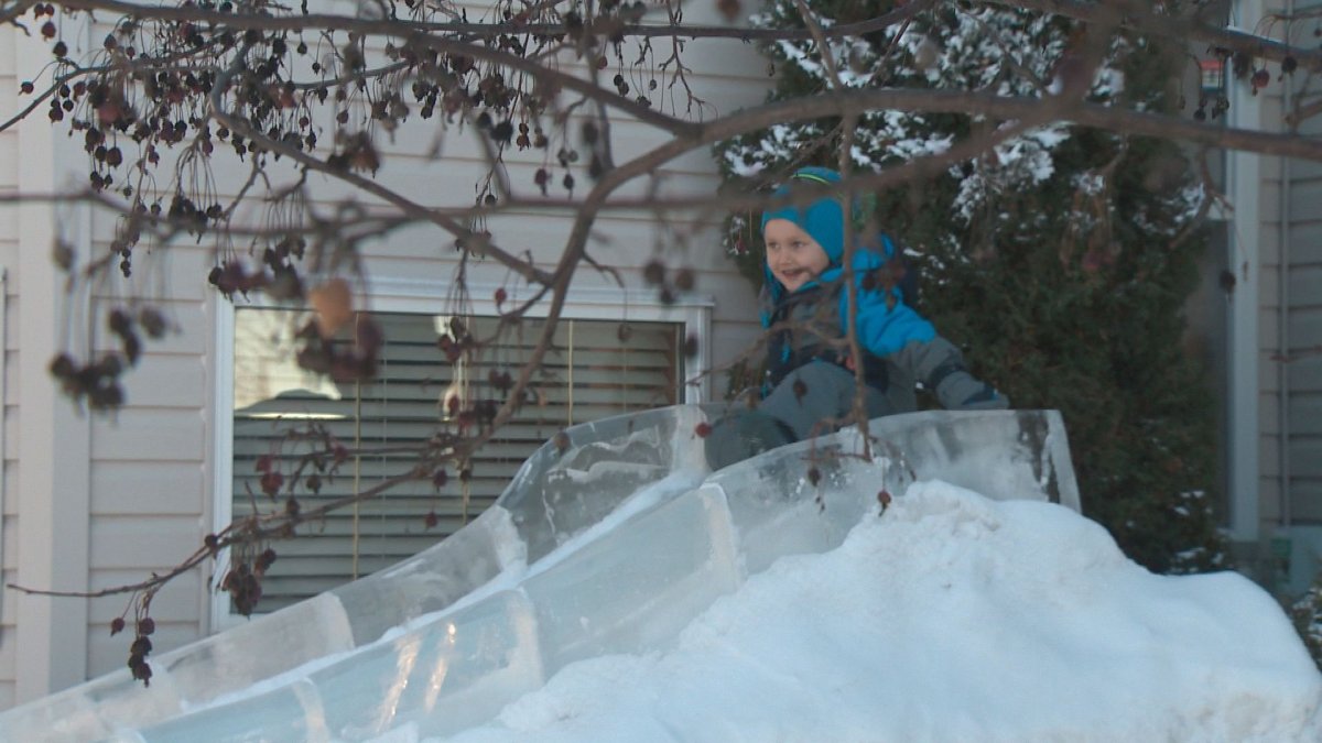 Ice carver uses leftovers to build massive slide in front yard