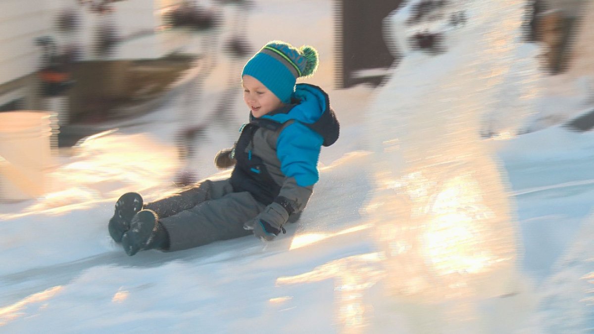 Ice carver uses leftovers to build massive slide in front yard