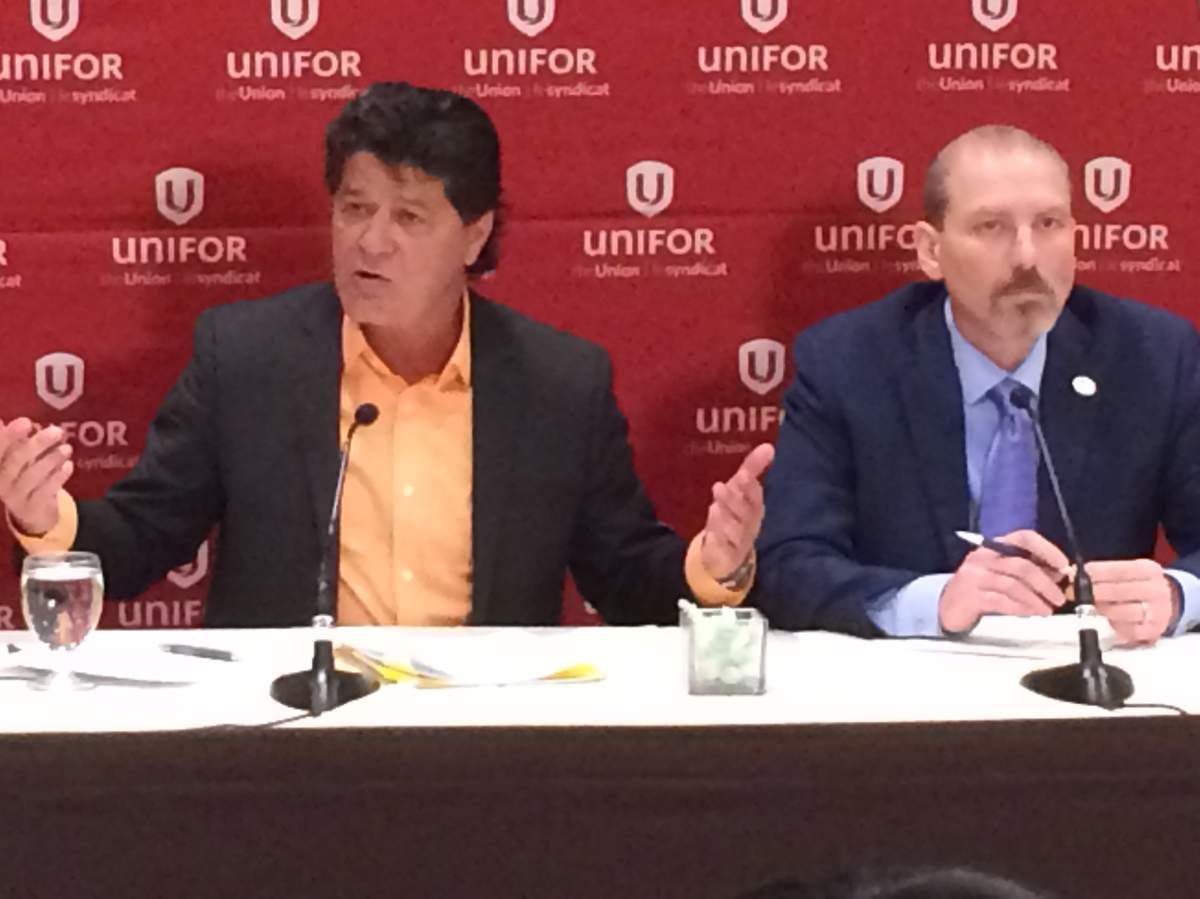 Unifor President Jerry Dias, (left) and Bob Kinnear (right), speak to reporters in Toronto on Feb. 7, 2017.