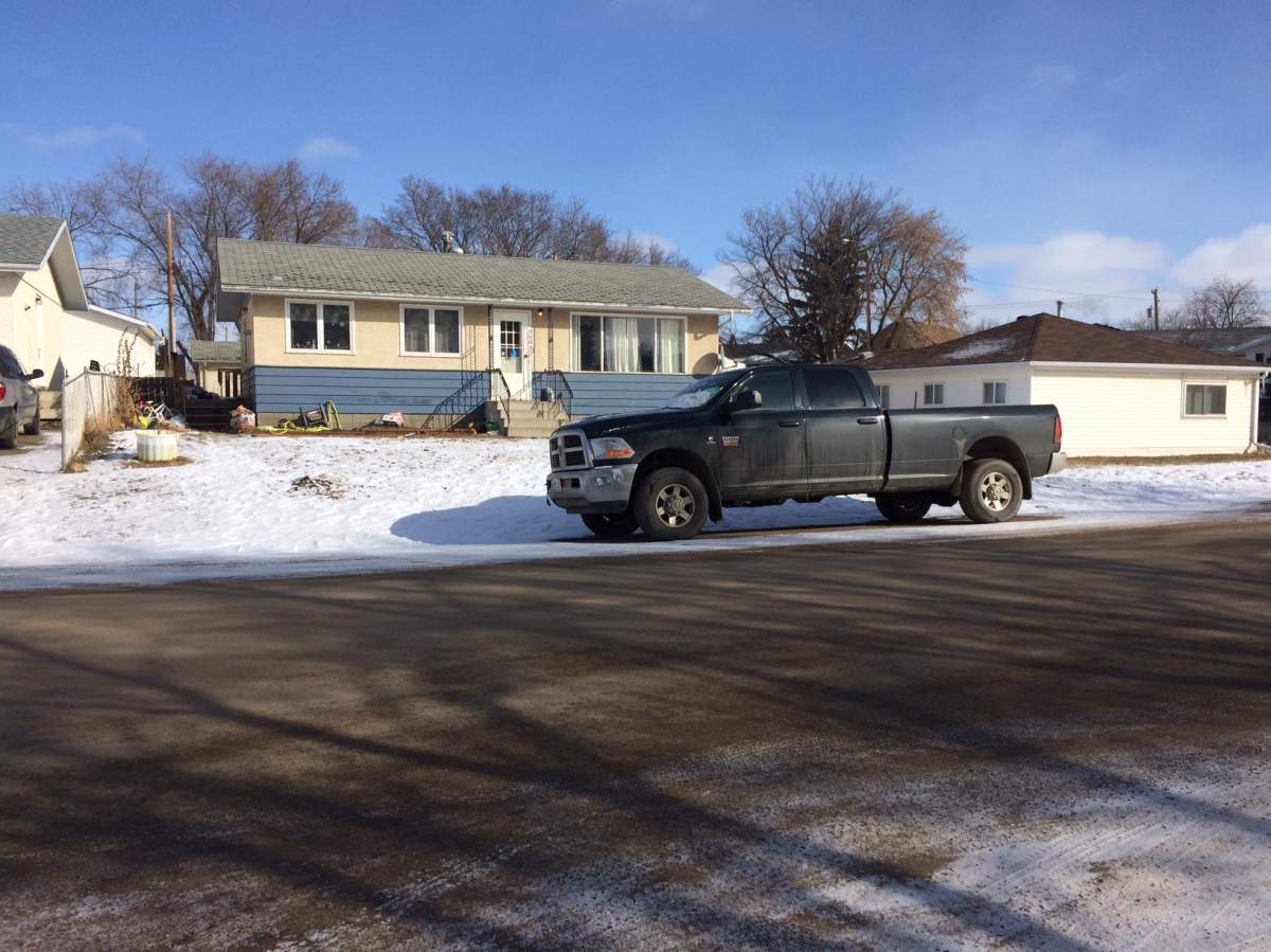 Police tape surrounds the Wainwright, Alta. home where Nichole Clifford, 31, was found dead on Friday, February 24, 2017.