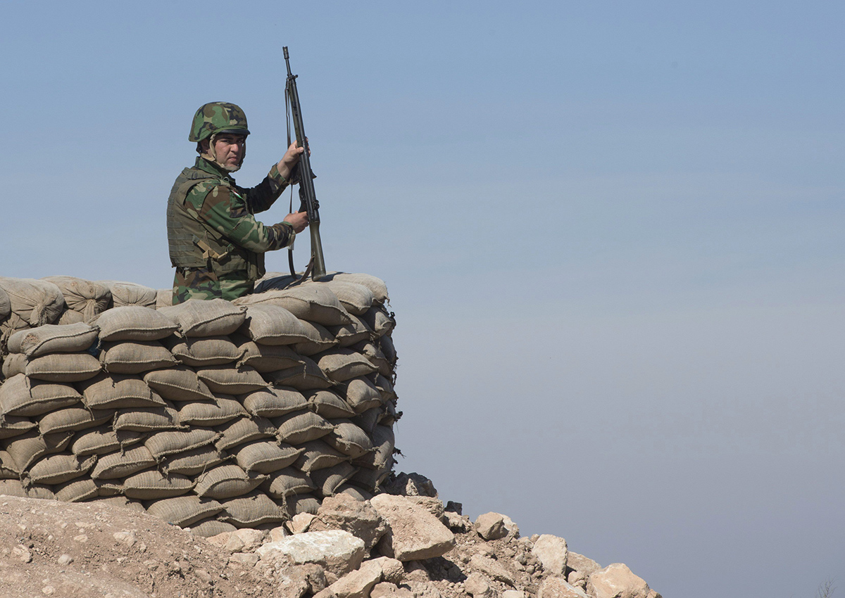 A Peshmerga soldier mans an observation post, Monday, February 20, 2017 in northern Iraq.