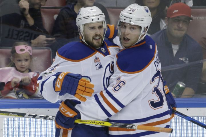 Edmonton Oilers defenseman Kris Russell, left, celebrates with left wing Drake Caggiula (36) after scoring against the Florida Panthers during the third period of an NHL hockey game, Wednesday, Feb. 22, 2017, in Sunrise, Fla. The Oilers defeated the Panthers 4-3. 
