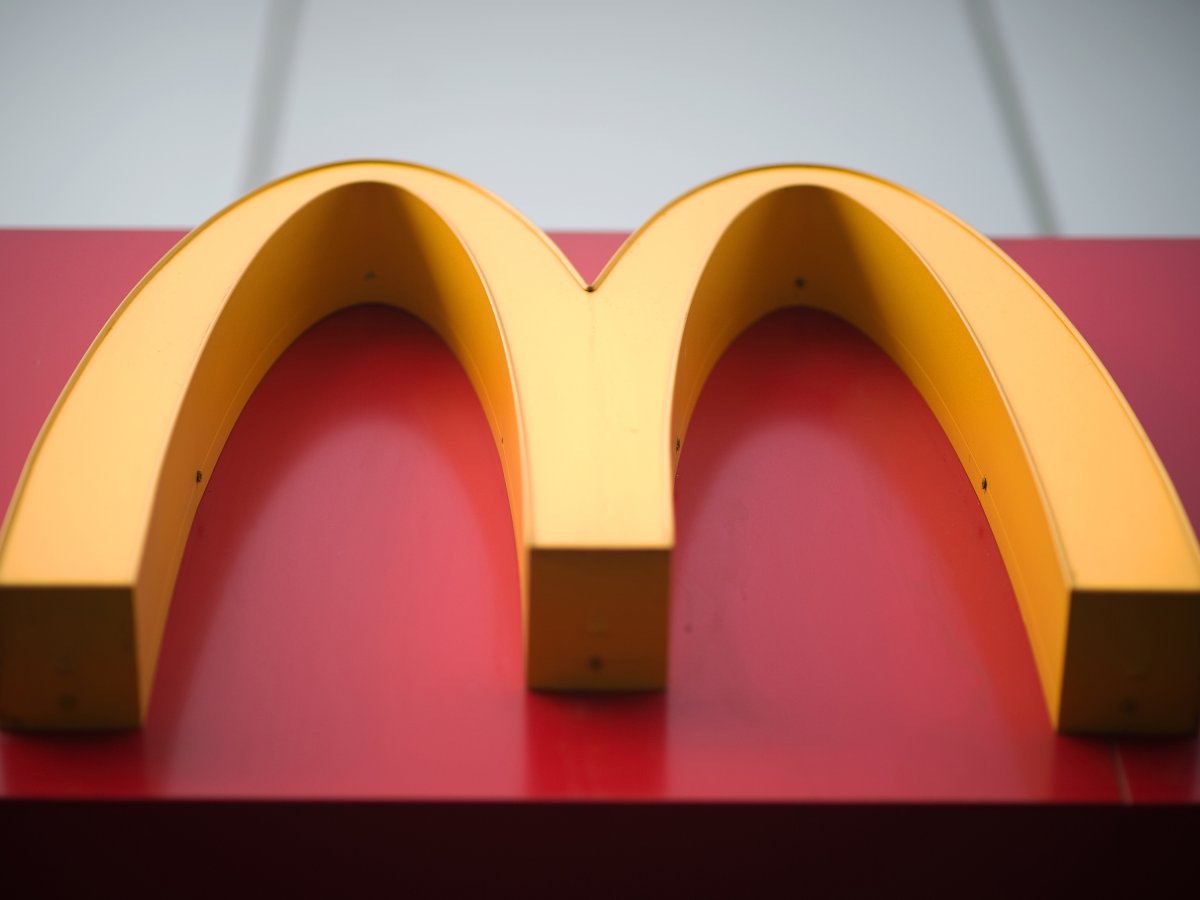 McDonald's fast food restaurant sign is seen in Beijing on January 9, 2017.
US fast-food giant McDonalds will sell a controlling stake in its China and Hong Kong business for up to 2.08 billion USD to a consortium including state-owned Citic and the Carlyle Group, it was announced on January 9. / AFP / NICOLAS ASFOURI        (Photo credit should read ).