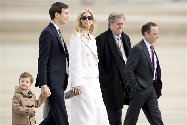 Ivanka Trump, daughter of President Donald Trump, her husband, senior adviser Jared Kushner, their two children Arabella Kushner and Joseph Kushner, Chief White House Strategist Steve Bannon, second from right, and Chief of Staff Reince Priebus.
