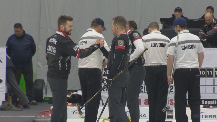 Mike McEwen celebrates a win with teammate Denni Neufeld at the Viterra Championship in Portage La Prairie on Friday.