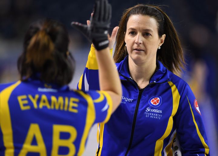Alberta alternate Heather Nedohin gives third Lisa Eyamie a high five after a win over Saskatchewan during the Scotties Tournament of Hearts in St. Catharines, Ont., on Tuesday, Feb. 21, 2017. 
