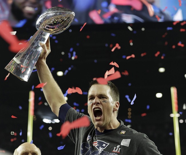 New England Patriots' Tom Brady hoists the Vince Lombardi Trophy after the NFL Super Bowl 51 football game against the Atlanta Falcons Sunday, Feb. 5, 2017, in Houston. The New England Patriots won 34-28 in overtime.