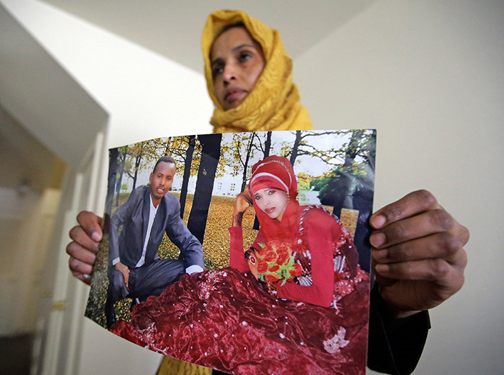Somali refugee Nimo Hashi holds a photo of her husband Tuesday, Jan. 31, 2017, in Salt Lake City.
