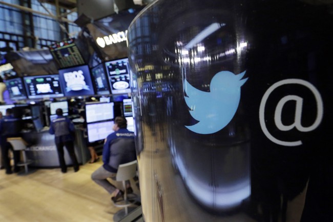 The Twitter logo appears on a phone post on the floor of the New York Stock Exchange, Oct. 31, 2015.