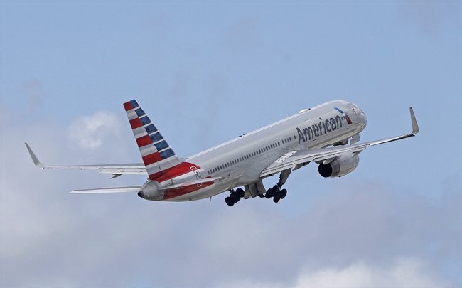 In this Friday, June 3, 2016 file photo, an American Airlines passenger jet takes off from Miami International Airport. 