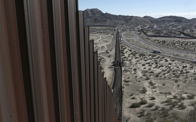 A truck drives near the Mexico-US border fence, on the Mexican side, separating the towns of Anapra, Mexico and Sunland Park, New Mexico. Jan. 25, 2017.
