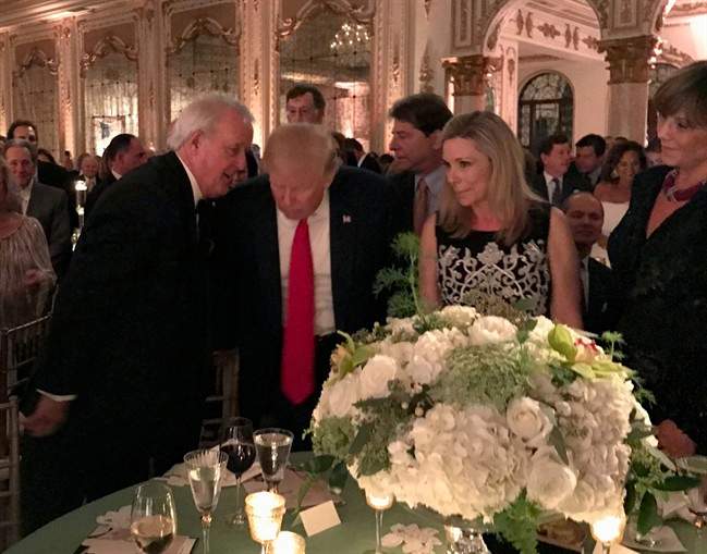 Former prime minister Brian Mulroney talks with U.S. President Donald Trump in Palm Beach, Fla., Saturday, Feb.18, 2017. 