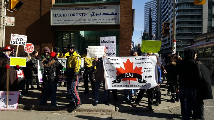A group of more than a dozen protesters demonstrated outside a Toronto mosque on Feb. 17, 2017. 