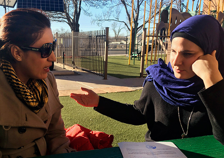 Immigrant Rana Elshekly, 36, left, talks to Qadria Naji, 26, at the Islamic Center of New Mexico in Albuquerque, N.M., Monday, Jan. 30, 2017.