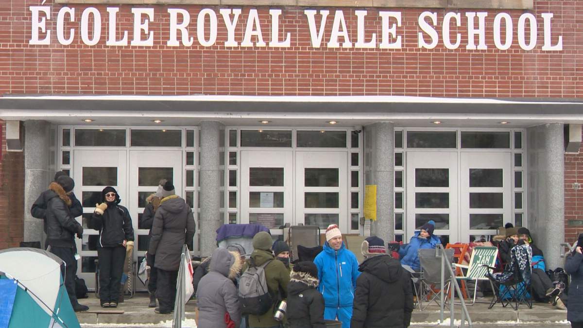 Despite cold weather, parents have already begun lining up for registration at Royal Vale School, Sunday, February 5, 2017.