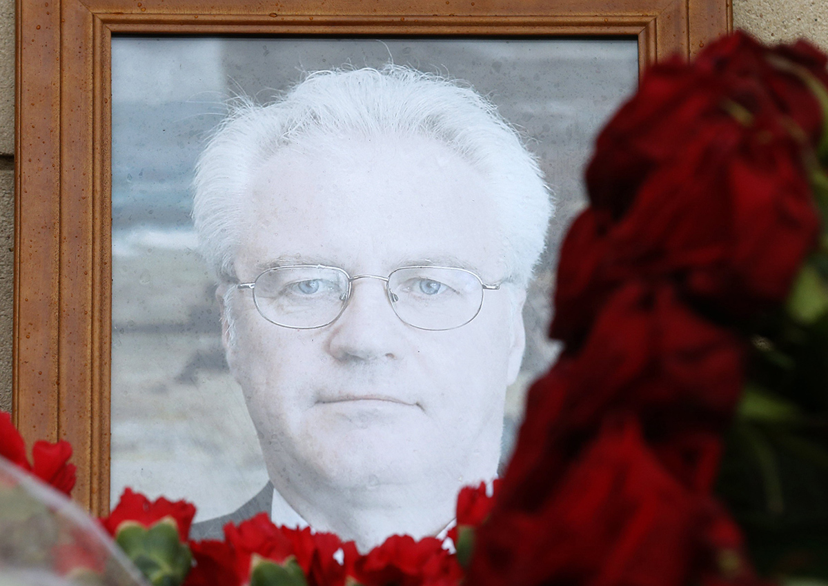 Flowers are placed near a portrait of late Russian Permanent Representative to the United Nations Vitaly Churkin at the Foreign Ministry headquarters in Moscow, Russia.